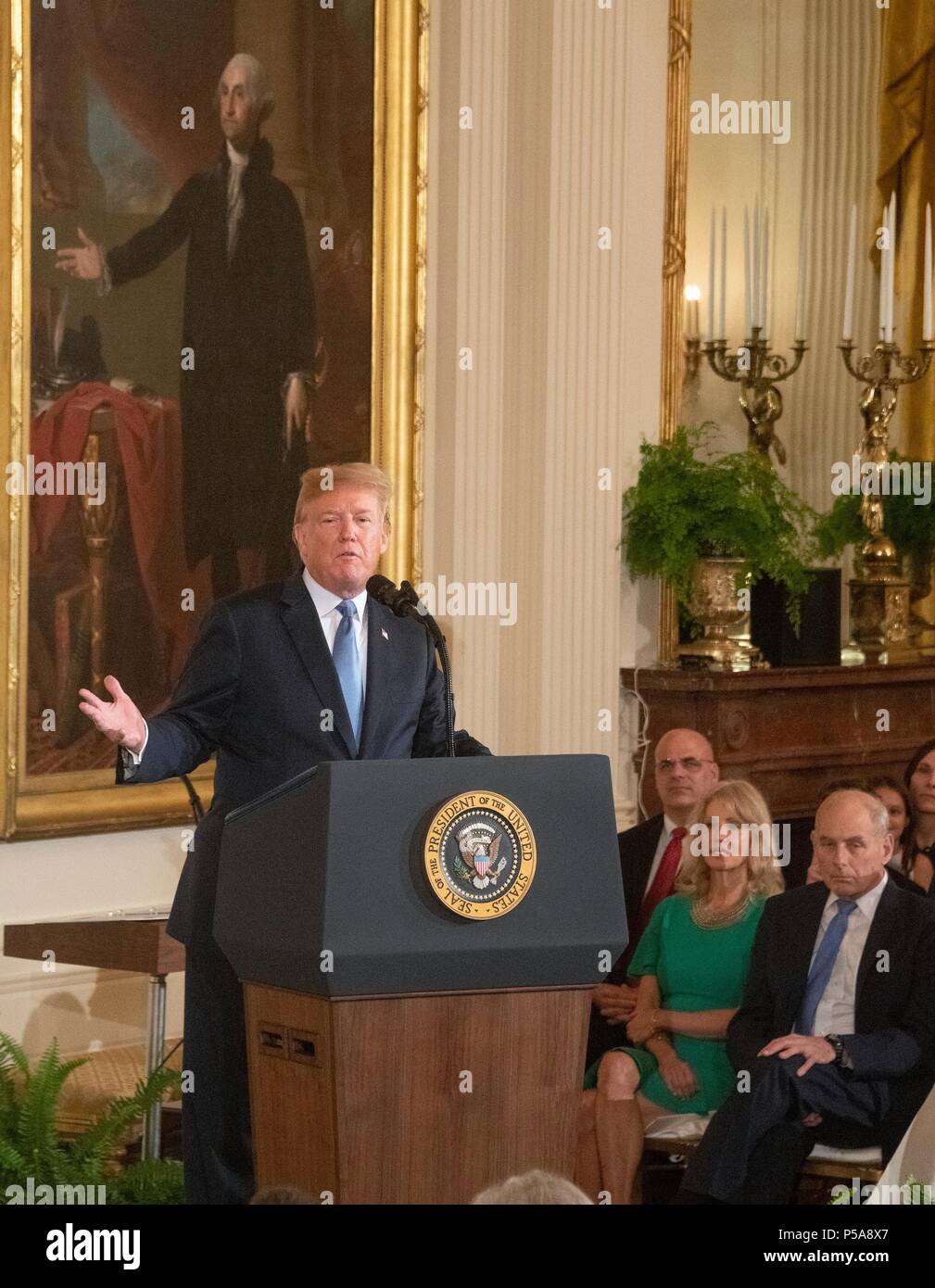 United States President Donald J. Trump makes remarks as he hosts a ceremony to posthumously award the Medal of Honor to then-First Lieutenant Garlin M. Conner, U.S. Army, for conspicuous gallantry during World War II in the East Room of the White House in Washington, DC on Tuesday, June 26, 2018. Conner is being honored for his actions on January 24,1945, while serving as an intelligence officer with Headquarters and Headquarters Company, 3d Battalion, 7th Infantry Regiment, 3d Infantry Division. Credit: Ron Sachs/CNP | usage worldwide Stock Photo