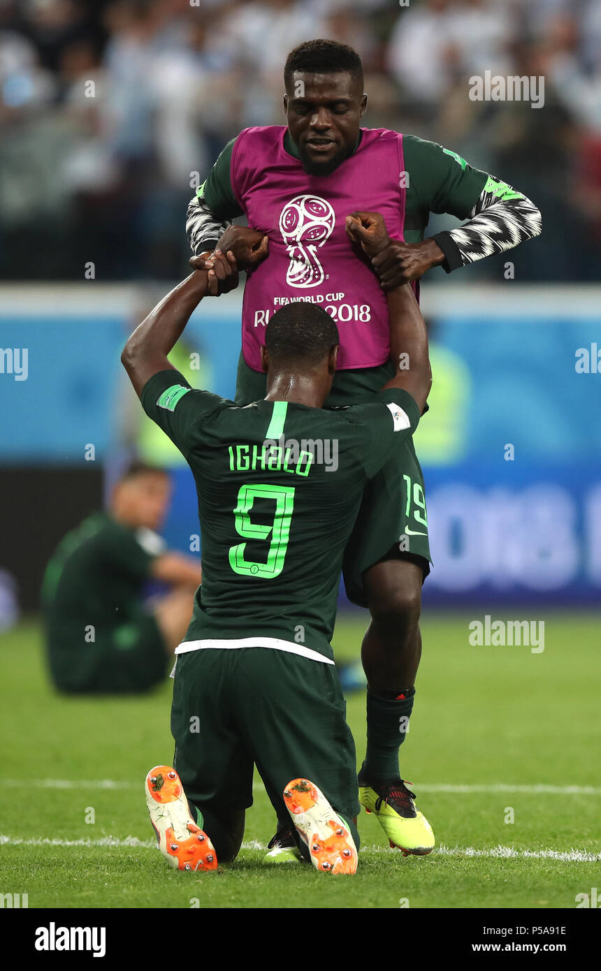 Saint Petersburg, Russia. 26th June, 2018. John Ogu (top) of Nigeria comforts Odion Ighalo after the 2018 FIFA World Cup Group D match between Nigeria and Argentina in Saint Petersburg, Russia, June 26, 2018. Argentina won 2-1 and advanced to the round of 16. Credit: Wu Zhuang/Xinhua/Alamy Live News Stock Photo