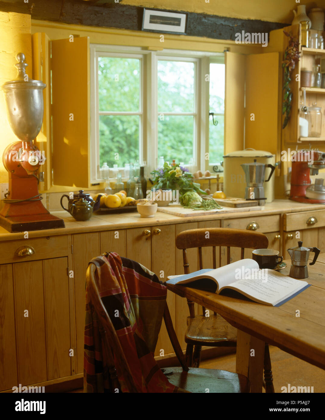 Download Wooden Shutters On Window In Yellow Cottage Kitchen With Vintage Mixer On Worktop Stock Photo Alamy Yellowimages Mockups