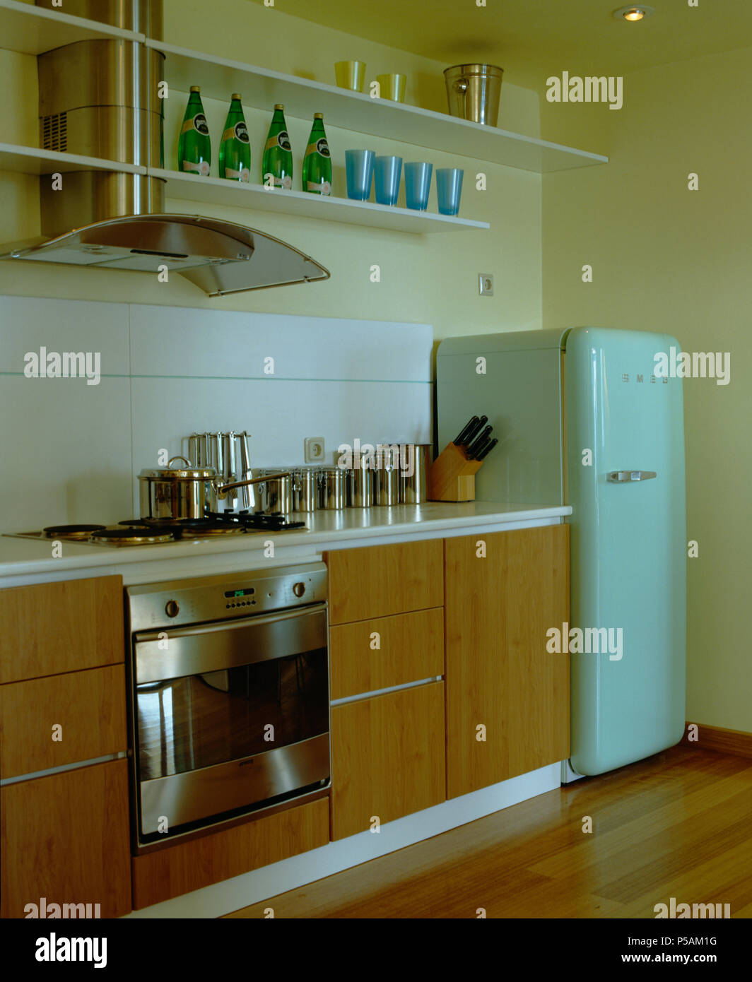 Modern kitchen with pale blue Smeg Fridge. Stock Photo