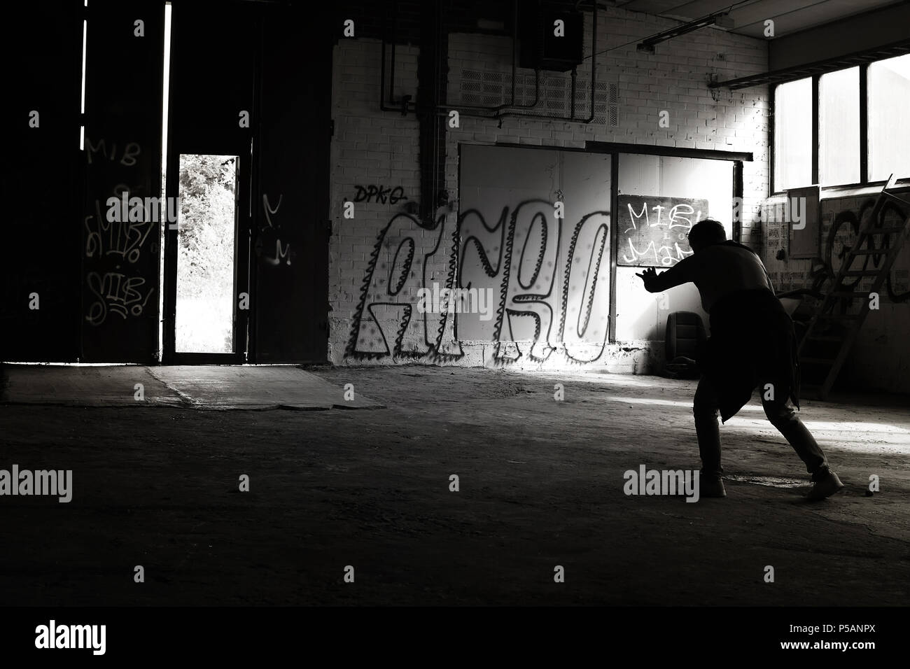 Unrecognizable, disoriented person struggling toward the light in a ...