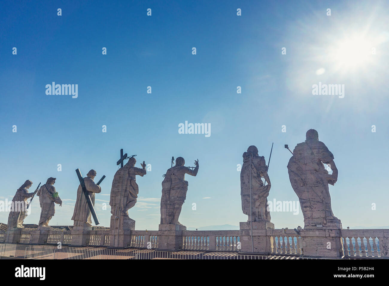 Statues on the top of st peters basilica hires stock photography and