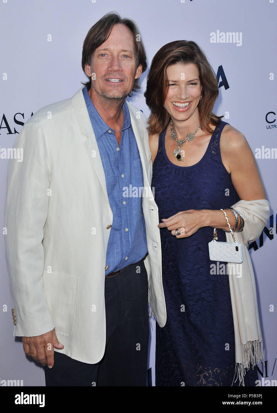Kevin Sorbo and wife Sam arriving The Paranoia Premiere at the DGA