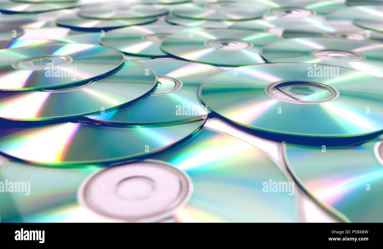 Stack of CD and DVD background. Stock Photo