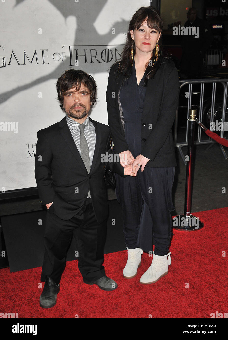 Peter Dinklage and wife Erica Smidt at the Game Of Thrones Premiere at the  Chinese Theatre in Los Angeles. Peter Dinklage and wife Erica Smidt  ------------- Red Carpet Event, Vertical, USA, Film