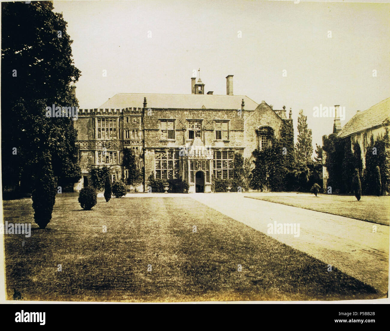 N/A. English: Brympton d'Evercy (also known as Brympton House), a manor house near Yeovil in the county of Somerset, England. Front entrance. circa 1860. Anon. But uploaded by R. de Salis, meRodolph2 (talk) 00:33, 24 July 2014 (UTC) 244 Brympton entrance front 1860 Stock Photo