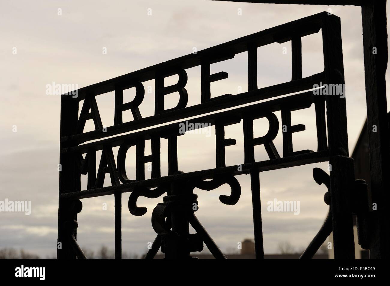 Dachau Concentration Camp. Nazi camp of prisoners opened in 1933. Detail of the slogan Arbeit macht frei (Labour makes free) at the main door. Germany. Stock Photo