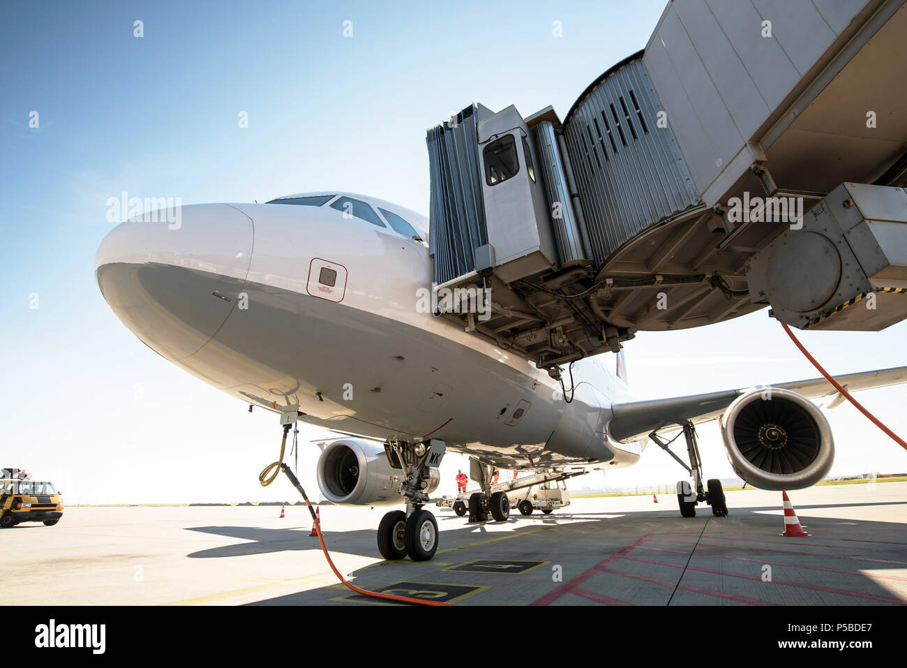 handling of an aircraft at the terminal of an airport before take-off Stock Photo