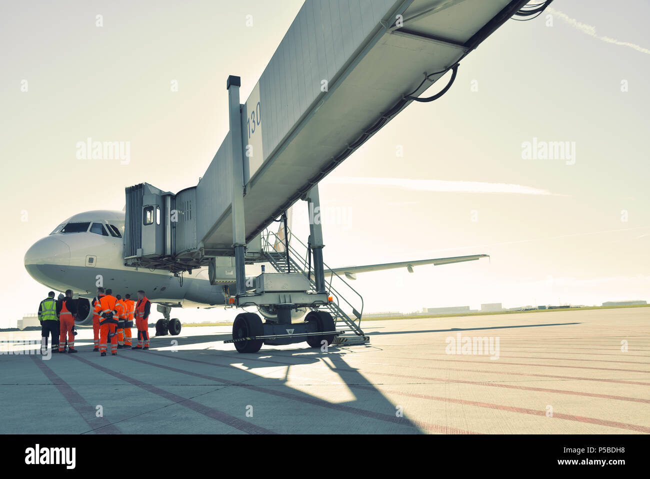 handling of an aircraft at the terminal of an airport before take-off Stock Photo