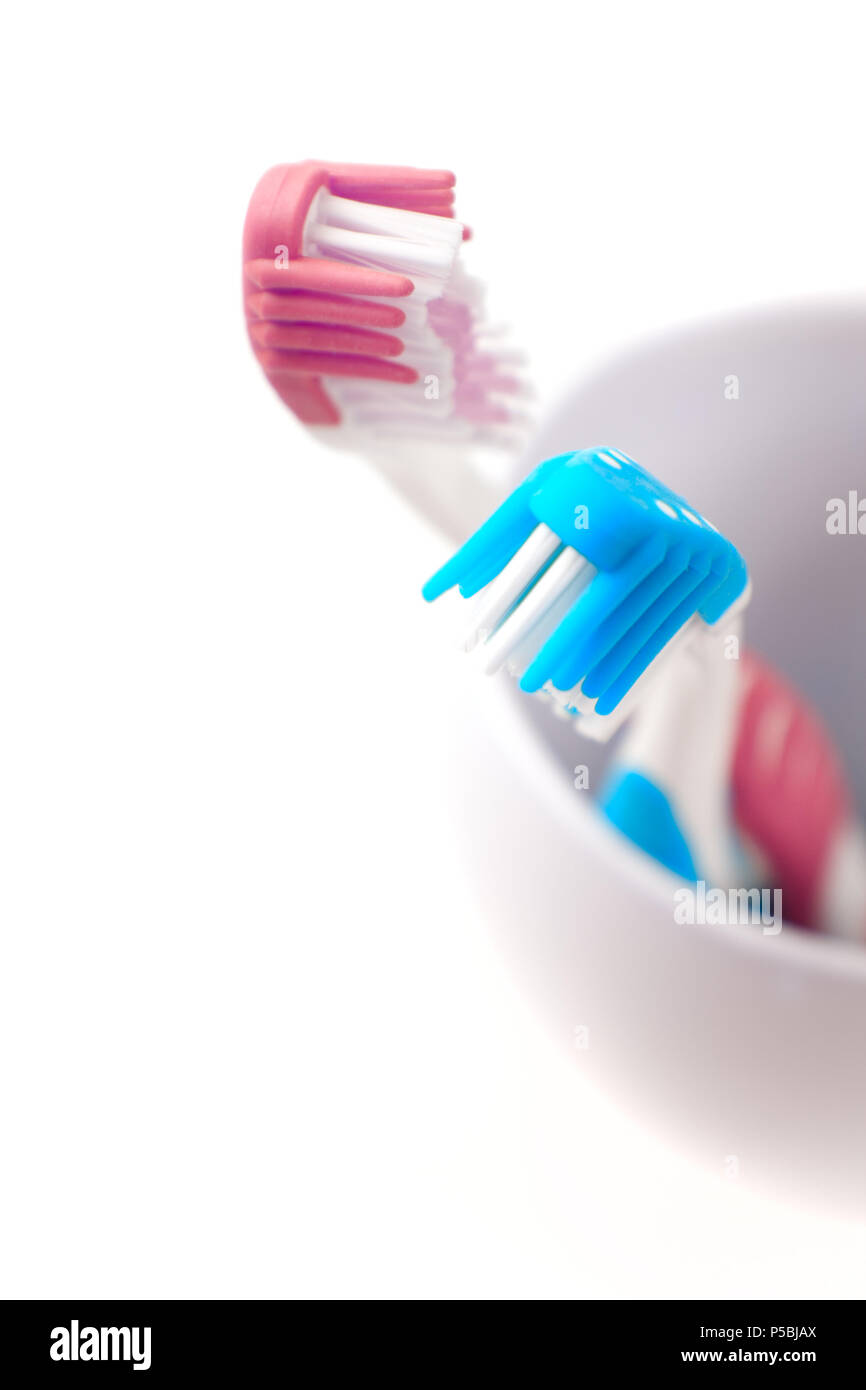 two toothbrushes on white background Stock Photo - Alamy