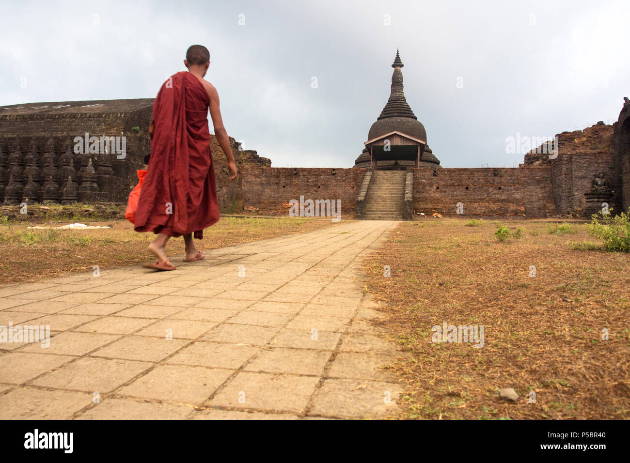Buddhist monk was walking to the temple, Mrauk u Myanmar Stock Photo