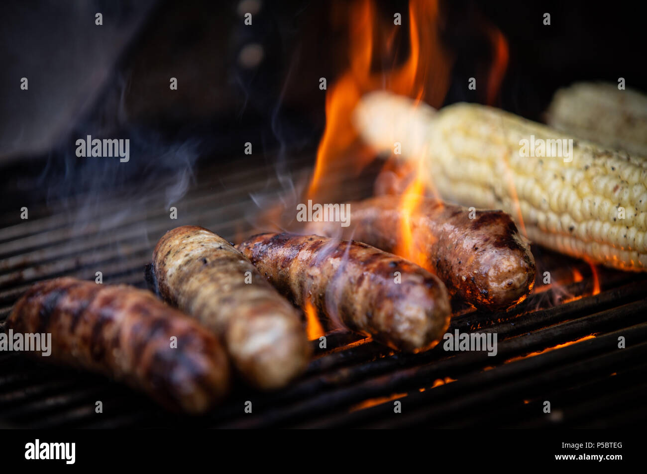 American Backyard BBQ with Sausages and Corn Stock Photo