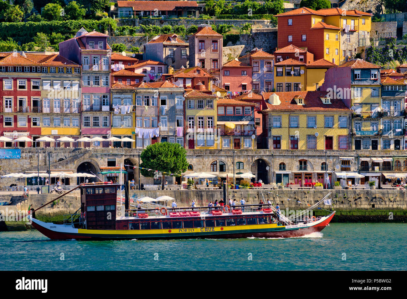 The Ribeira district of Oporto, with a traditional excursion barge (barco de rabelo) Stock Photo