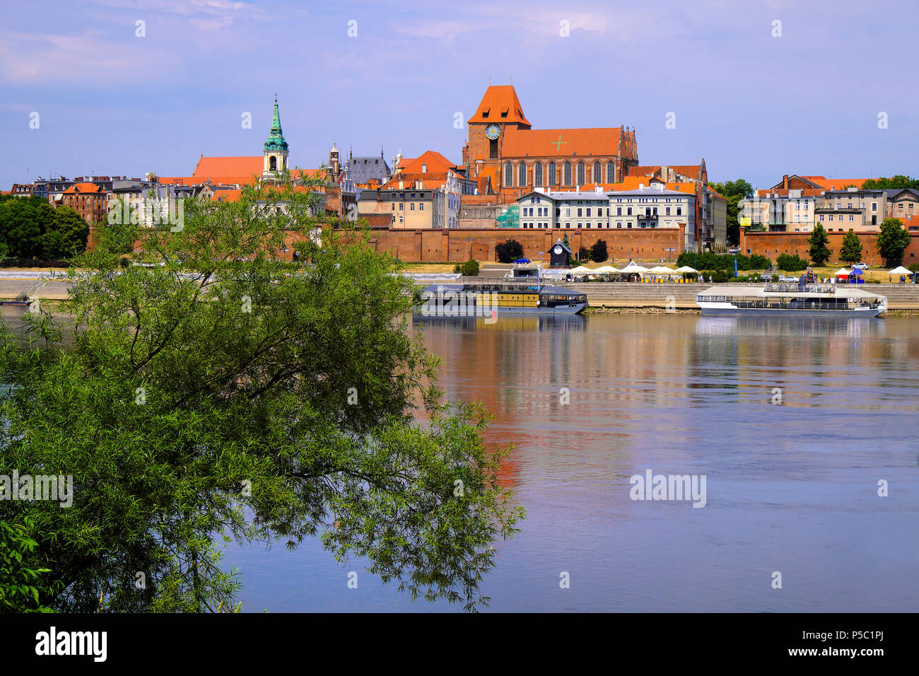 Torun, Kujavian-Pomeranian / Poland - 2018/06/10: Panoramic view of historical district of Torun old town by the Vistula river Stock Photo