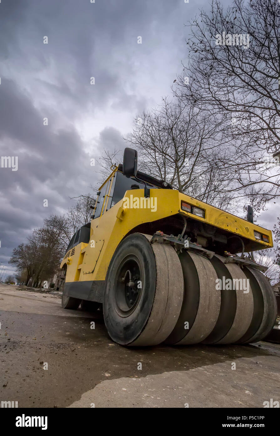 Close view on the road roller. Street paving works. Wide angle Stock Photo