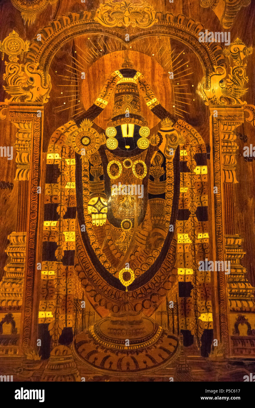 Wooden painting of Lord Tirupathi at hotel lobby, Kumbakonam, Tamil Nadu, India Stock Photo