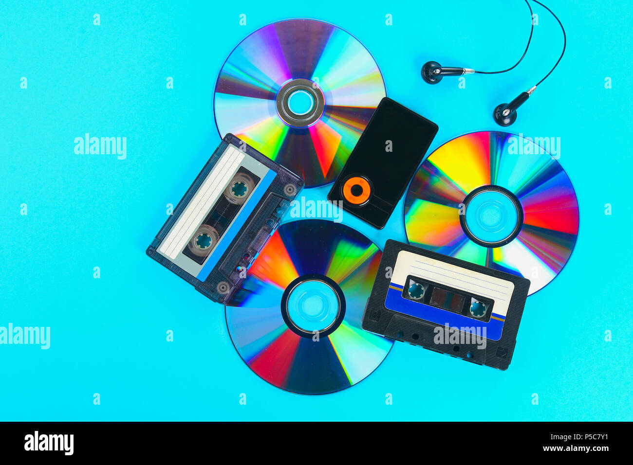 The concept of the evolution of music. Cassette, CD-disk, mp3 player.  Vintage and modernity. Music support Stock Photo - Alamy