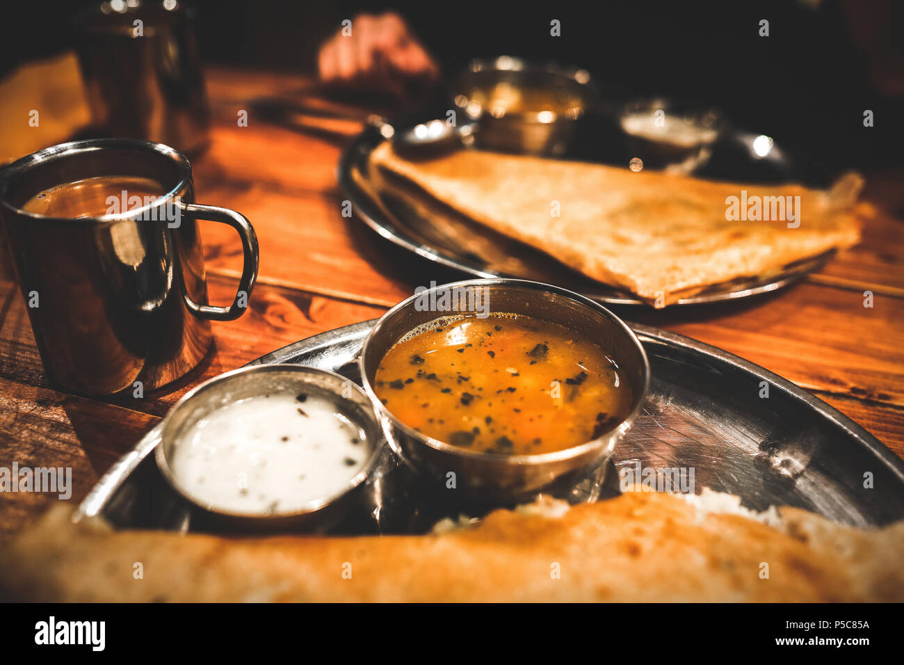 Indian vegeterian food in cafe. Vintage grain toning. Stock Photo