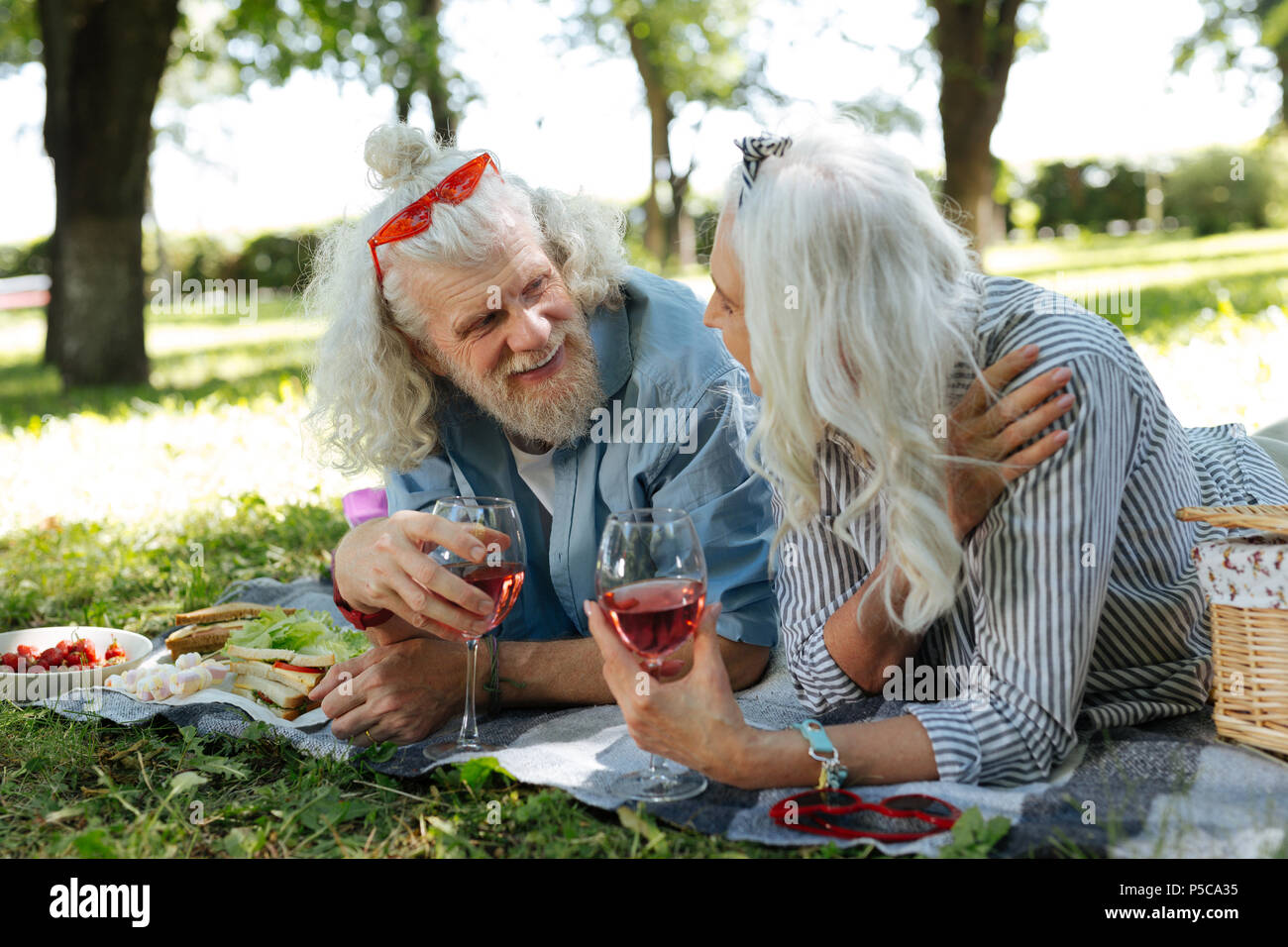 Delighted nice couple having a conversation Stock Photo