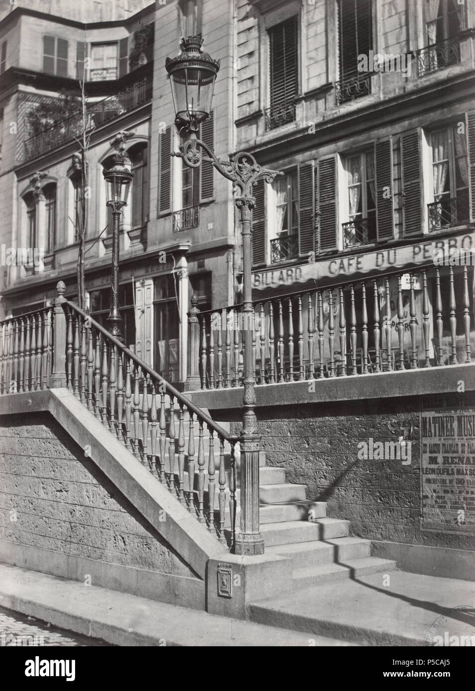 Escalier du Bd. St. Martin. no. 29. English: Single globe with iron lamp post mounted as part of the newel post of a flight of steps up to another path. 1878. N/A 327 Charles Marville, Escalier du boulevard Saint-Martin, 1878 Stock Photo