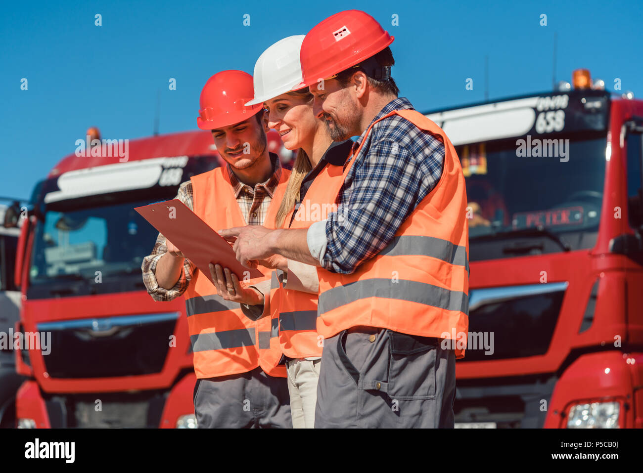 Driver and booker of heavy transport cargo company  Stock Photo