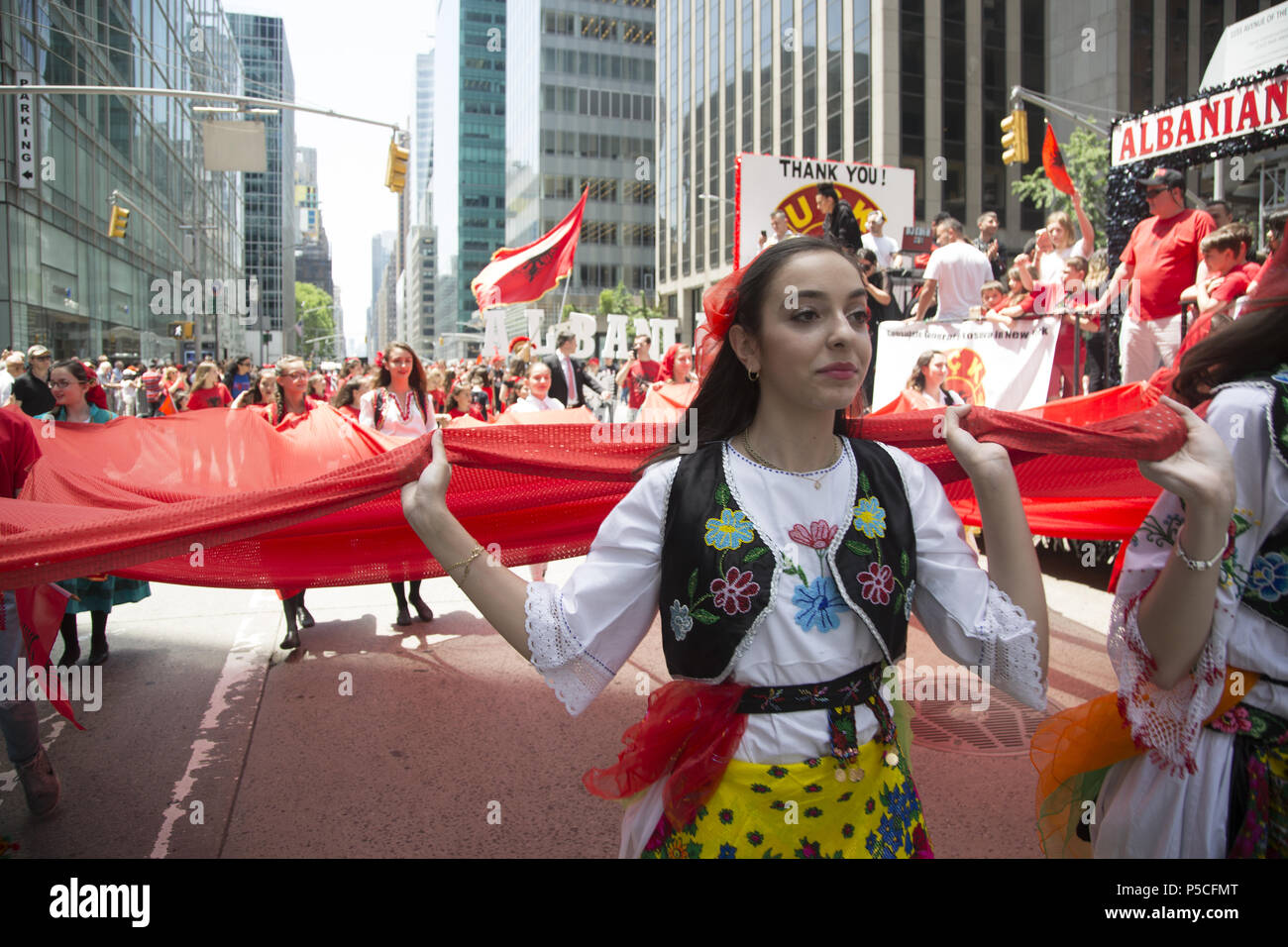 Proud energetic Albanian Americans march in the International Immigrants Parade along 6th Avenue in New York City. Stock Photo