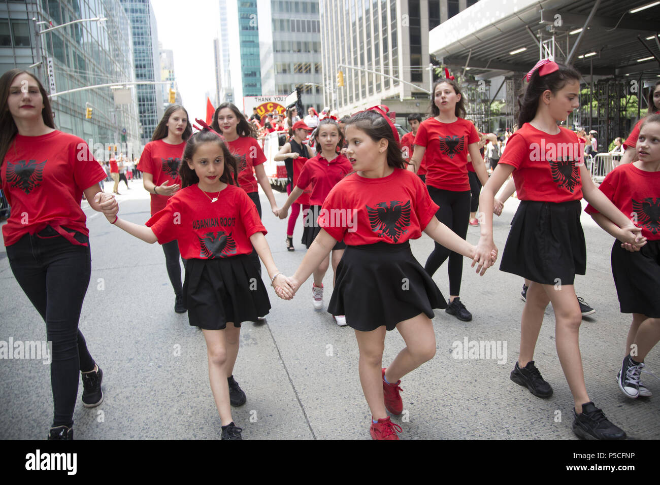 Proud energetic Albanian Americans march in the International Immigrants Parade along 6th Avenue in New York City. Stock Photo