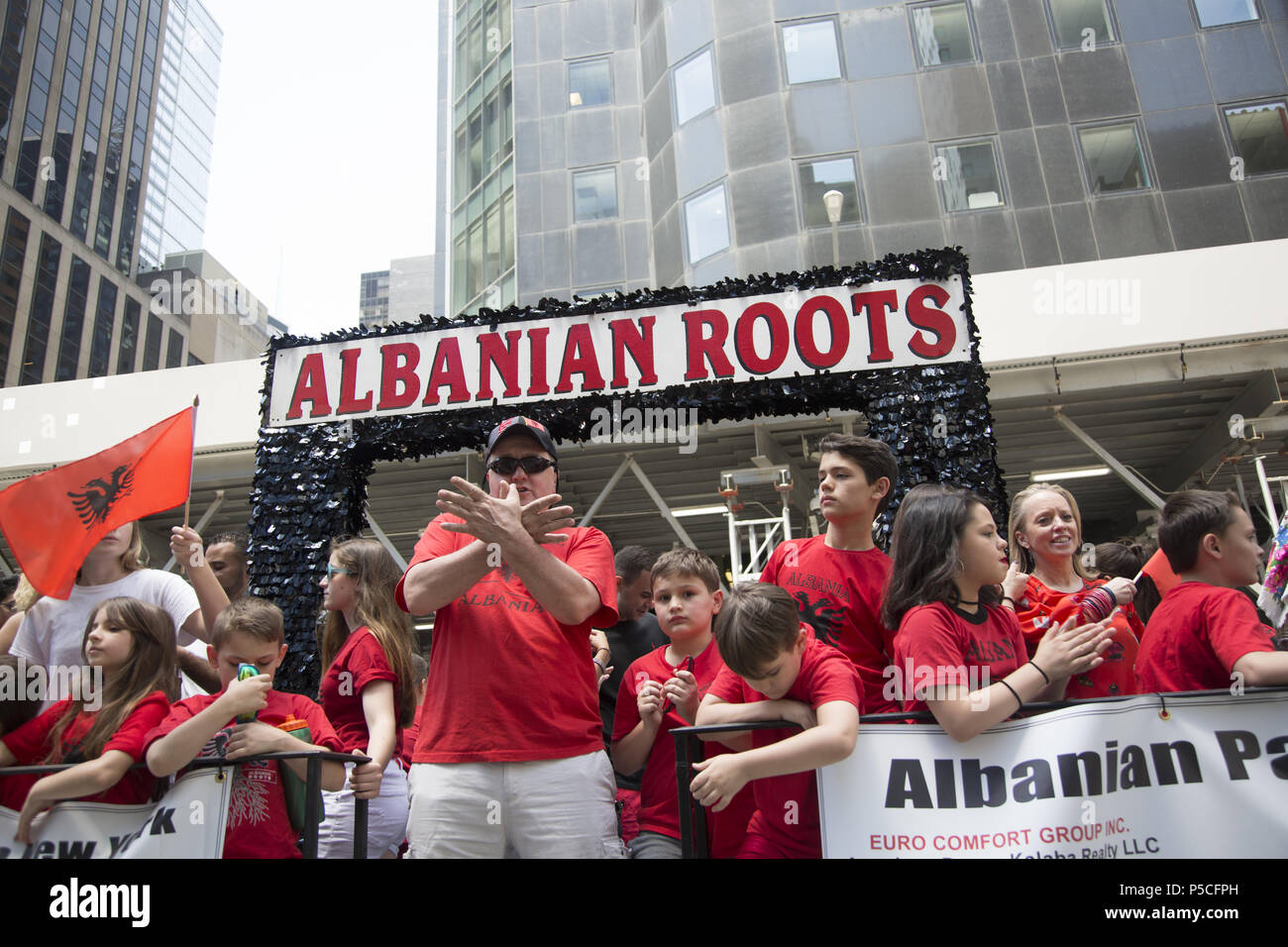 Proud energetic Albanian Americans march in the International Immigrants Parade along 6th Avenue in New York City. Stock Photo