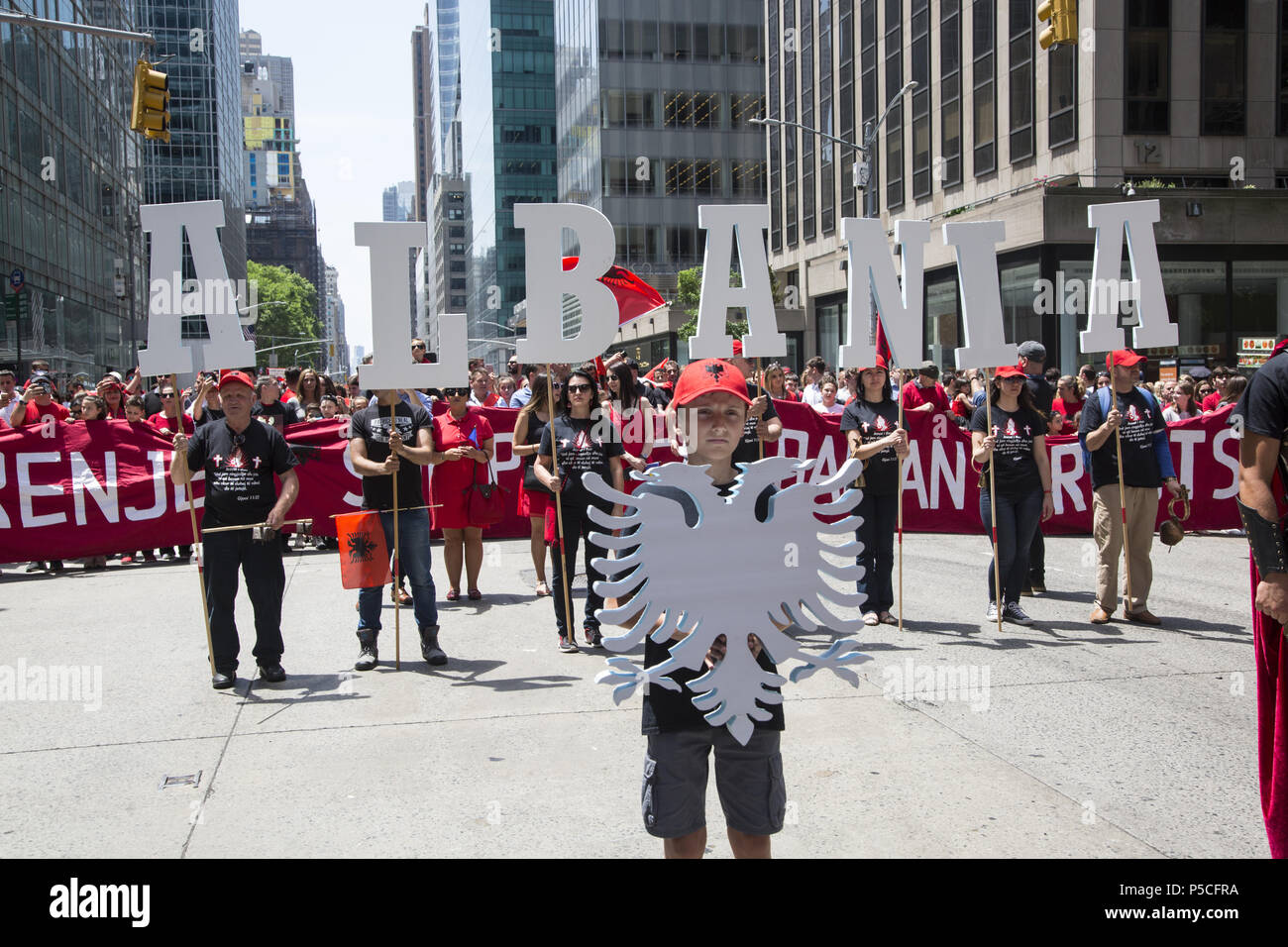 Proud energetic Albanian Americans march in the International Immigrants Parade along 6th Avenue in New York City. Stock Photo