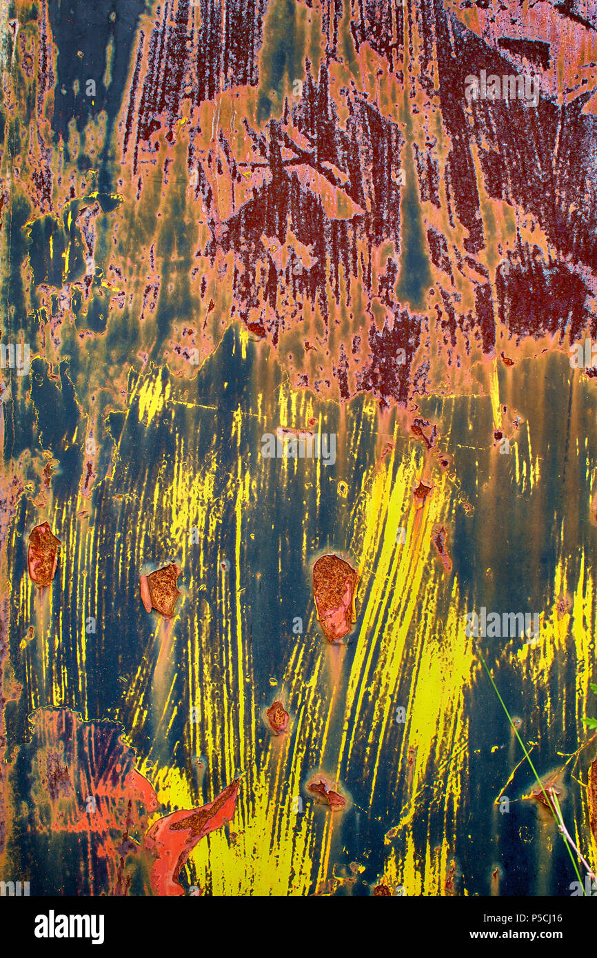 Closeup of rusty, colorful metal wall as background. Stock Photo