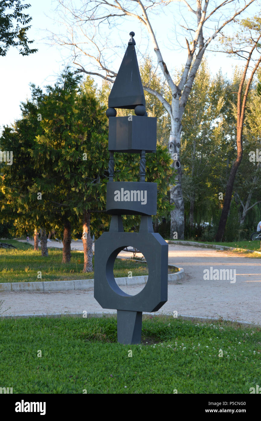 Iron sculpture consists of several geometric pieces in a park. Spain Stock Photo