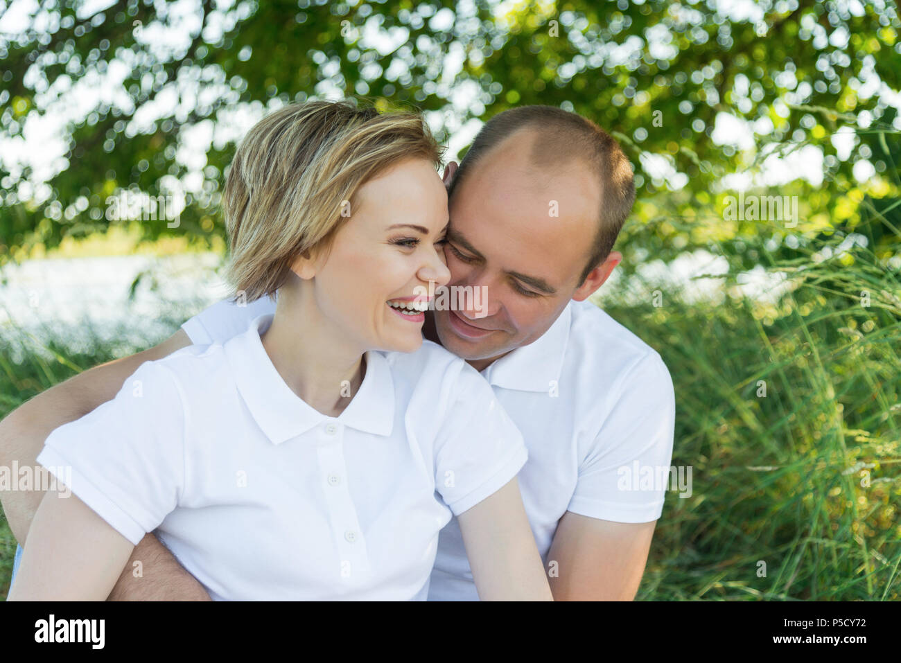 Woman man hug smile in love hi-res stock photography and images - Alamy