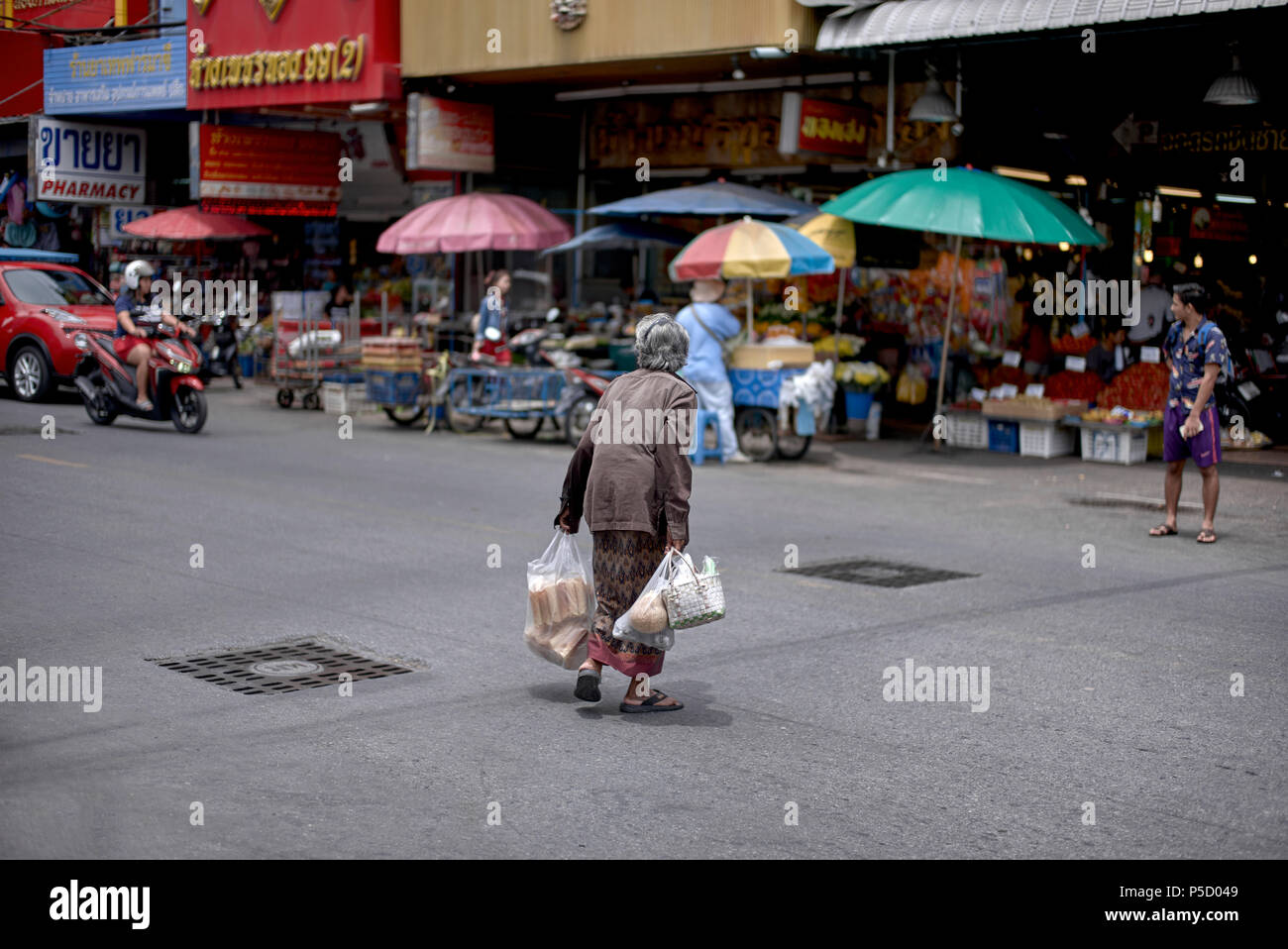 Elderly people crossing road hi-res stock photography and images - Alamy