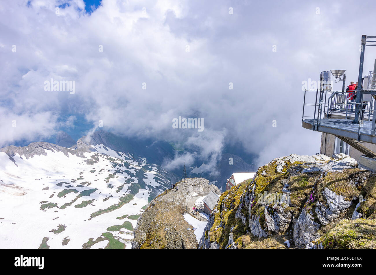 On the peak of Säntis Mountain, Appenzell Alps, Switzerland - weather station and observatory buildings with a view of the surrounding mountain range. Stock Photo