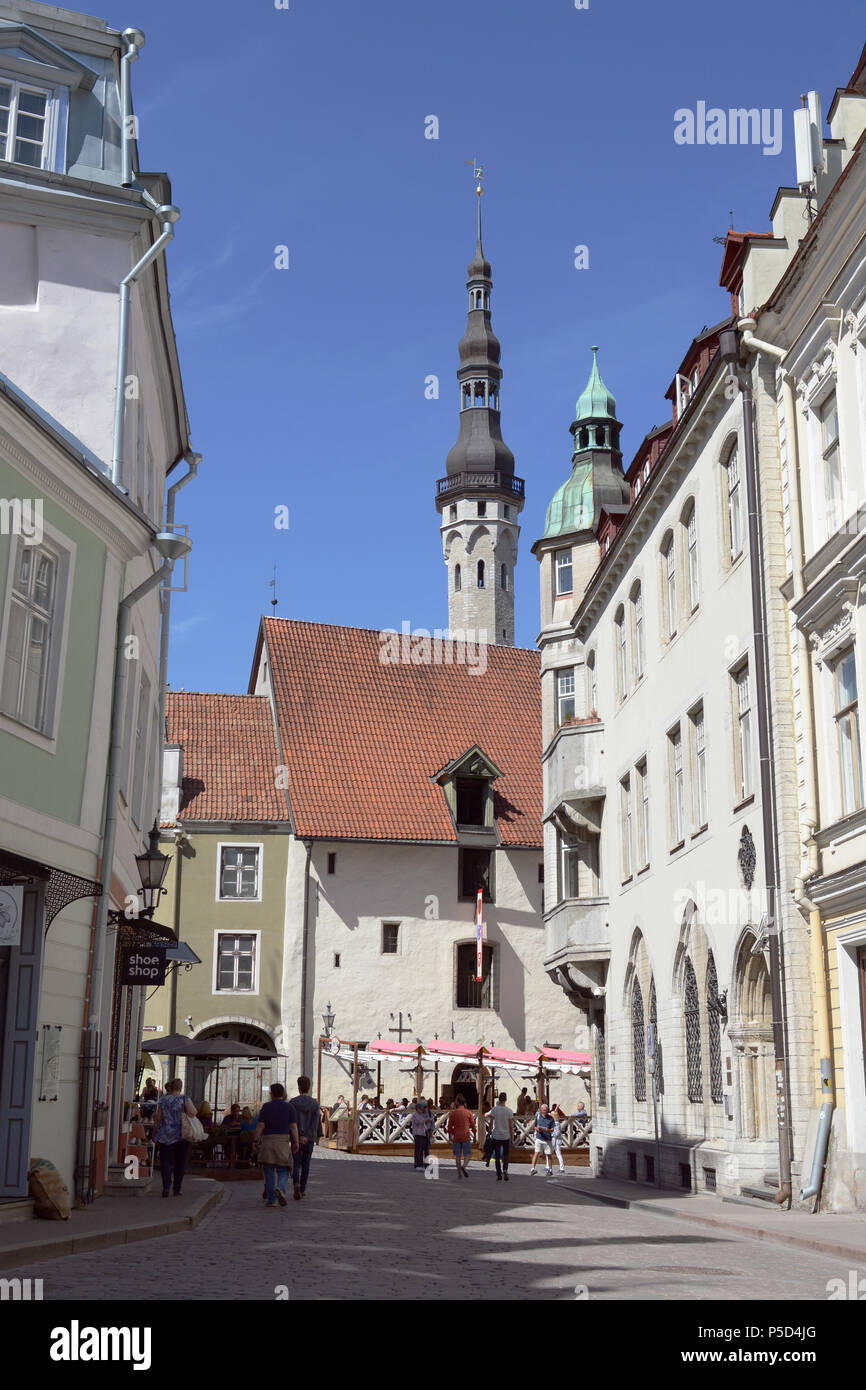 TALLINN, ESTONIA - May 12, 2018: View along Suur Karja street in Tallinn Old Town. At the end of the road, the St Nicholas Church tower rises above Ol Stock Photo