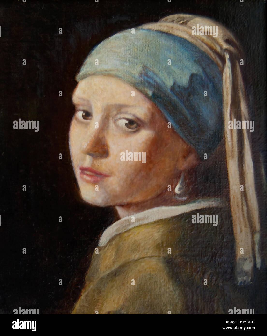 English: Girl with a Pearl Earring . Copy by Lawrence Saint of the painting of the same name by Jan Vermeer (1632-1675) . circa 1950. Lawrence Saint, after   Johannes Vermeer  (1632–1675)      Alternative names Johannes van der Meer, Jan Vermeer, Jan Vermeer van Delft, Johannes Reyniersz. Vermeer  Description Dutch painter and art dealer  Date of birth/death 31 October 1632 (baptised) 15 December 1675 (buried)  Location of birth/death Delft Delft  Work period 1653–1675  Work location Delft (1653–1675)  Authority control  : Q41264 VIAF: 51961439 ISNI: 0000 0001 0901 268X ULAN: 500032927 LCCN: n Stock Photo