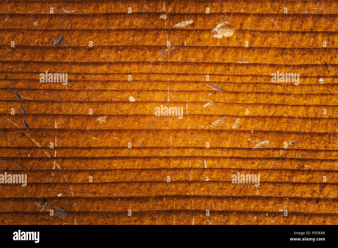 Texture of a wooden cello, old, dusty and scratched surface. Stock Photo
