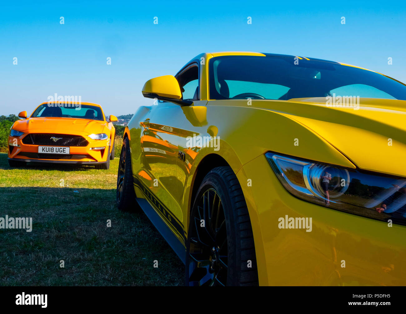 2 cool fast cars, 2 European right hand drive Ford Mustang 5 litre V8 GT Fastback Auto cars Stock Photo
