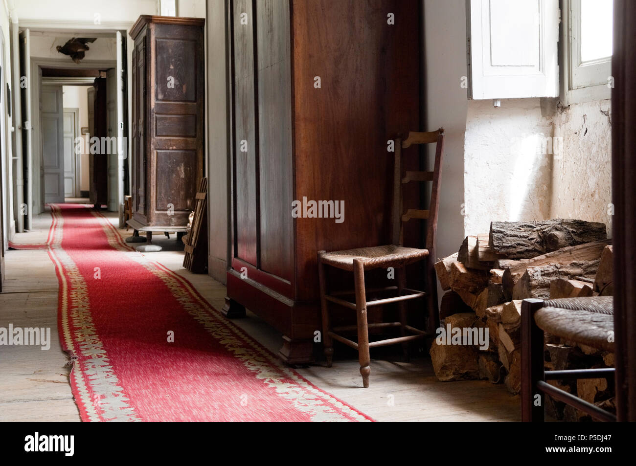 Rug in rustic hallway Stock Photo - Alamy