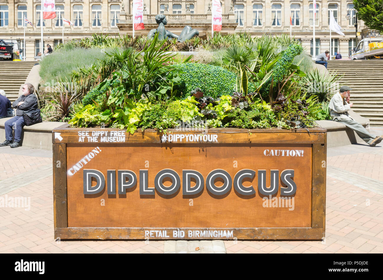 Plant troughs with dinosaurs made from plant displays to publicise Dippy on Tour, the Diplodocus,at Birmingham Museum and Art Gallery Stock Photo