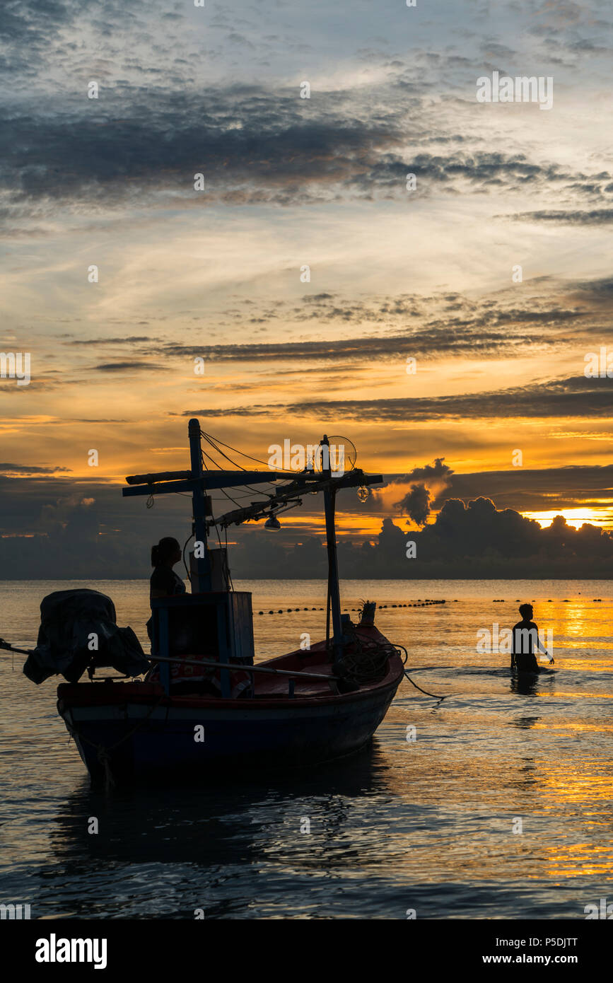 Fisherman prepare to work in dawn. Stock Photo