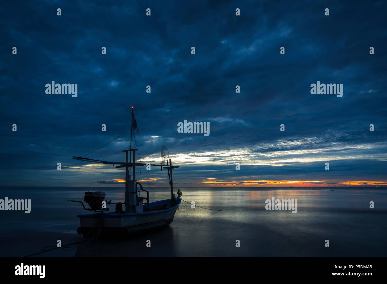 Fish boat rest on a for work in dawn. Stock Photo