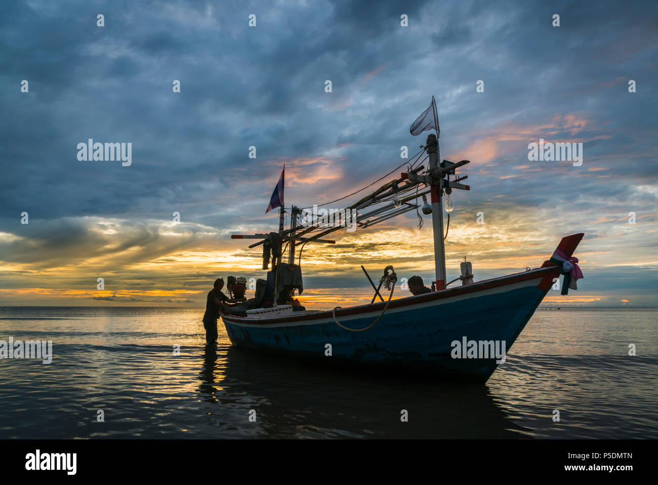 Tropical fishing boat in dawn. Stock Photo