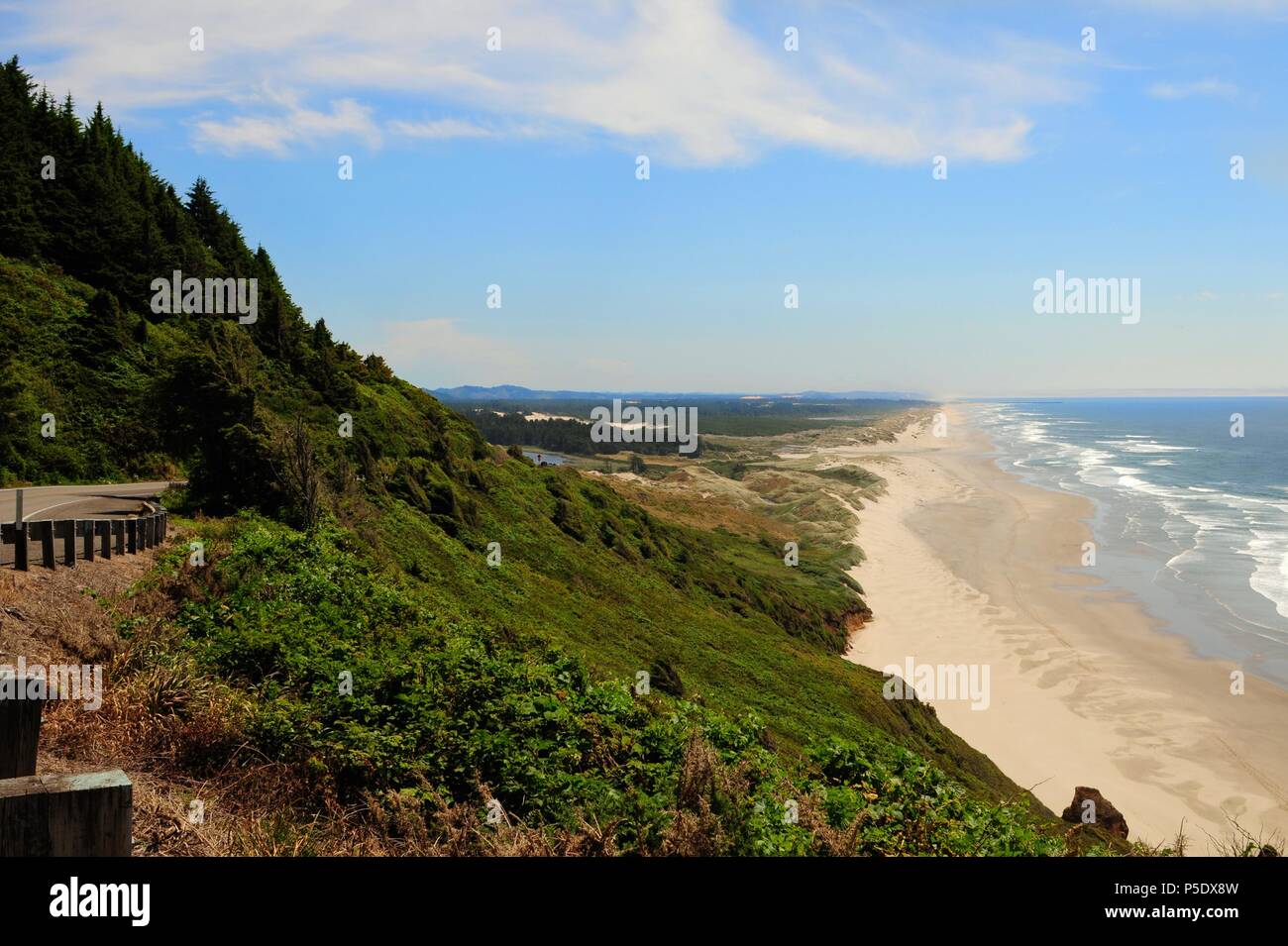 View of a long beach and coastline looking towards Florence on the Oregon Central coast, along Highway 101 Stock Photo