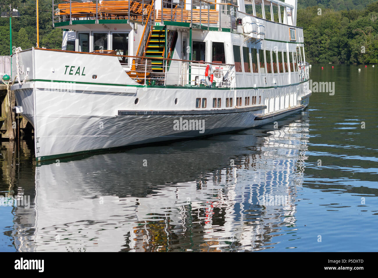 The MV Teal, on of the Windermere Lake Cruiser Fleet, tied up at the pier at Bowness-On-Windermere in the Lake District National Park Stock Photo