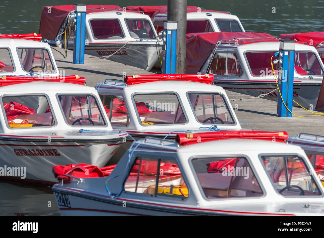 Electrical Powered motor boats for hire to tourists at Bowness-On Windermere in the English Lake District National Park Stock Photo
