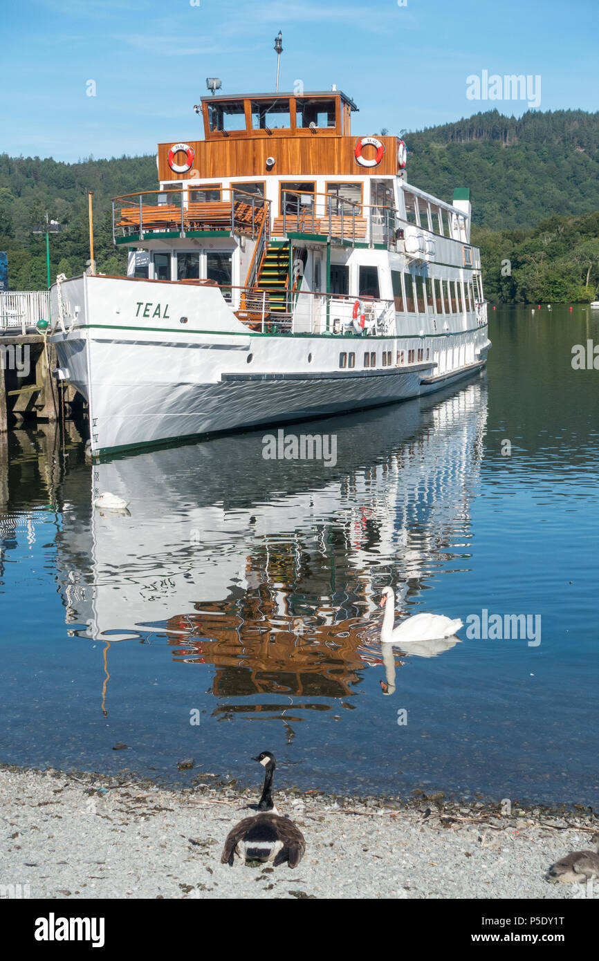 The MV Teal, on of the Windermere Lake Cruiser Fleet, tied up at the pier at Bowness-On-Windermere in the Lake District National Park Stock Photo