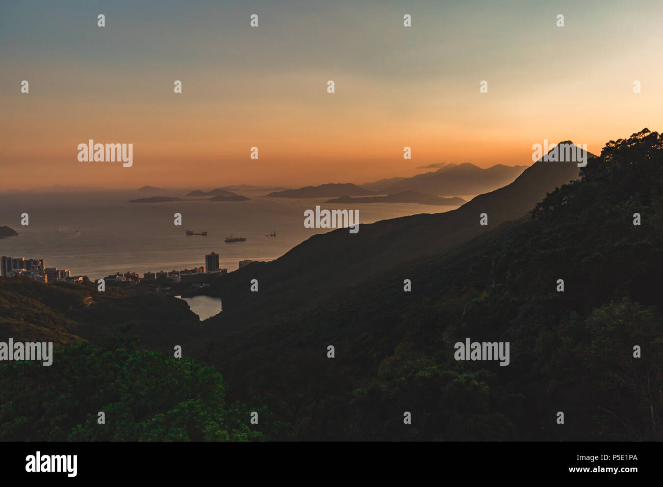Mountains and islands view around Hong Kong at sunset Stock Photo