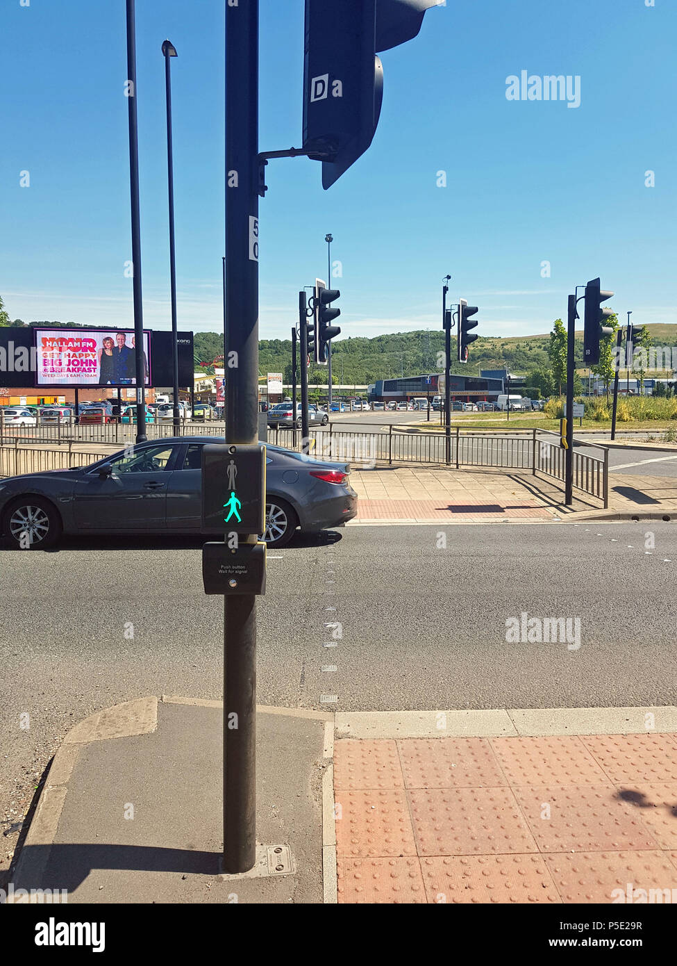 The pedestrian crossing on the A61 Penistone Road in Sheffield, where Leslie Bingham, 73, died when he was in collision with a marked police, as a hearing has heard how it appeared that Mr Bingham may have been confused by the 'green man' indication on an adjacent crossing which made him believe it was safe to cross the main road. Stock Photo