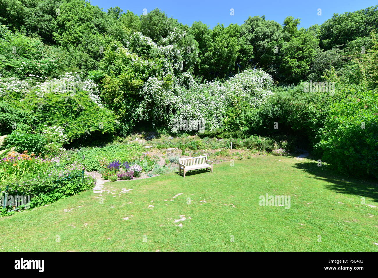 A rest area in an English country garden in summertime. Stock Photo